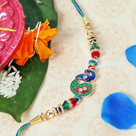 Peacock Rakhi with green red & white stones