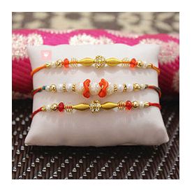 Beautiful Pearl Rakhi along with two Beaded Rakhi