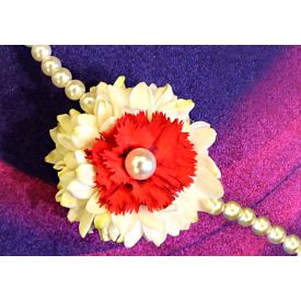 Pretty rakhi with fresh red carnation