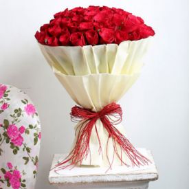 Bunch of 30 red roses with paper packing