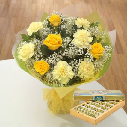 Yellow and White carnation and Sweets