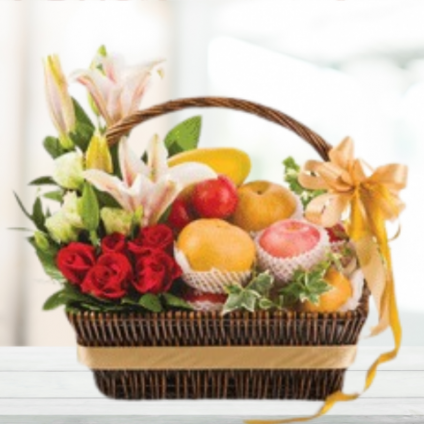 Basket of Fresh fruits and seasonal flowers