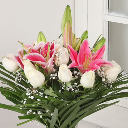 Pink lilies and white Rose with vase