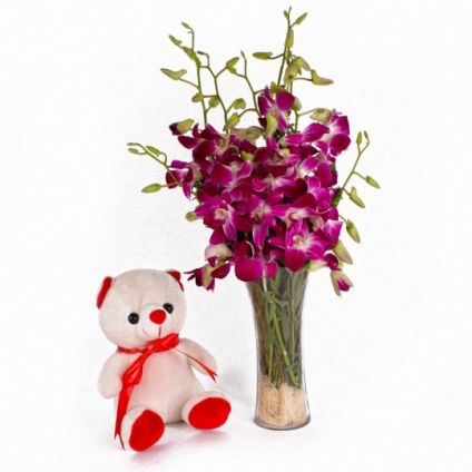 Orchids in vase And Small Teddy bear