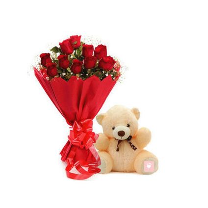 Red roses and cream teddy bear