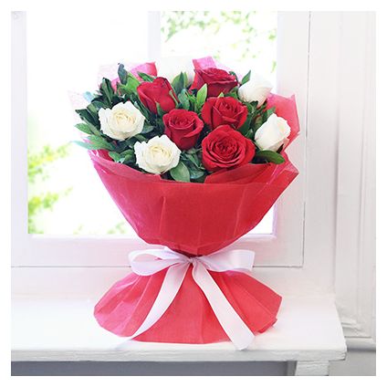 Bunch of red and white roses with paper packing