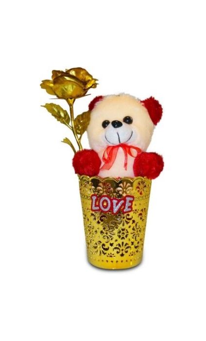 Golden roses in vase with soft toy